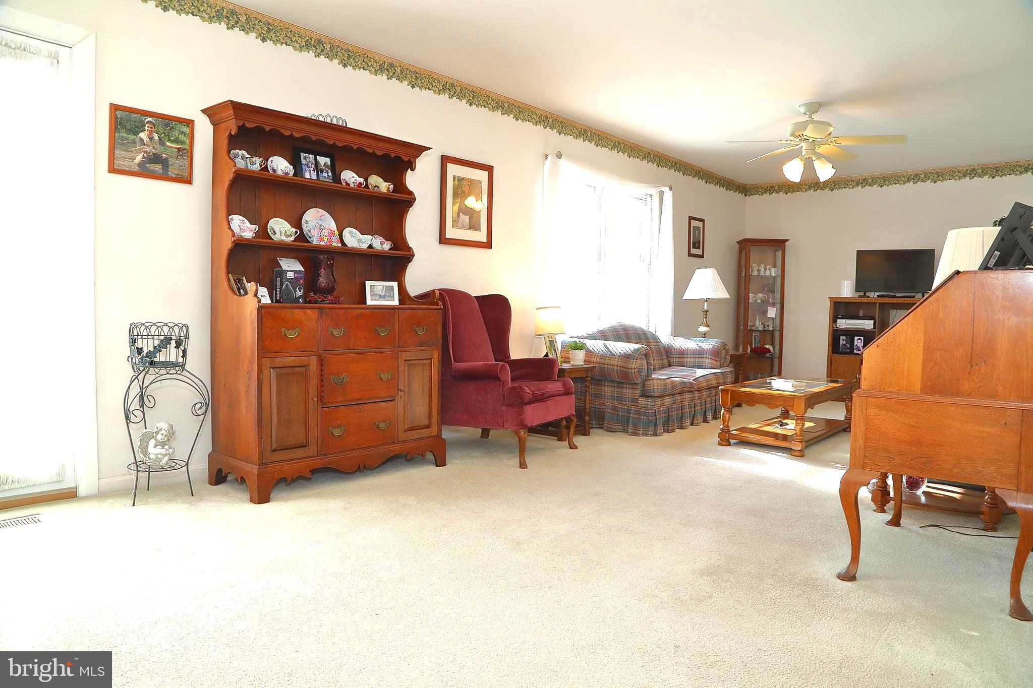 11 Duffield Drive Lititz, PA 17543 - Photo 3 of 22 a living room with furniture and a chandelier