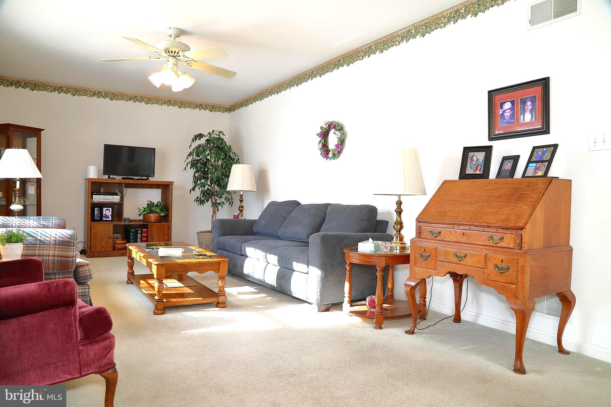 11 Duffield Drive Lititz, PA 17543 - Photo 4 of 22 a living room with furniture and a flat screen tv