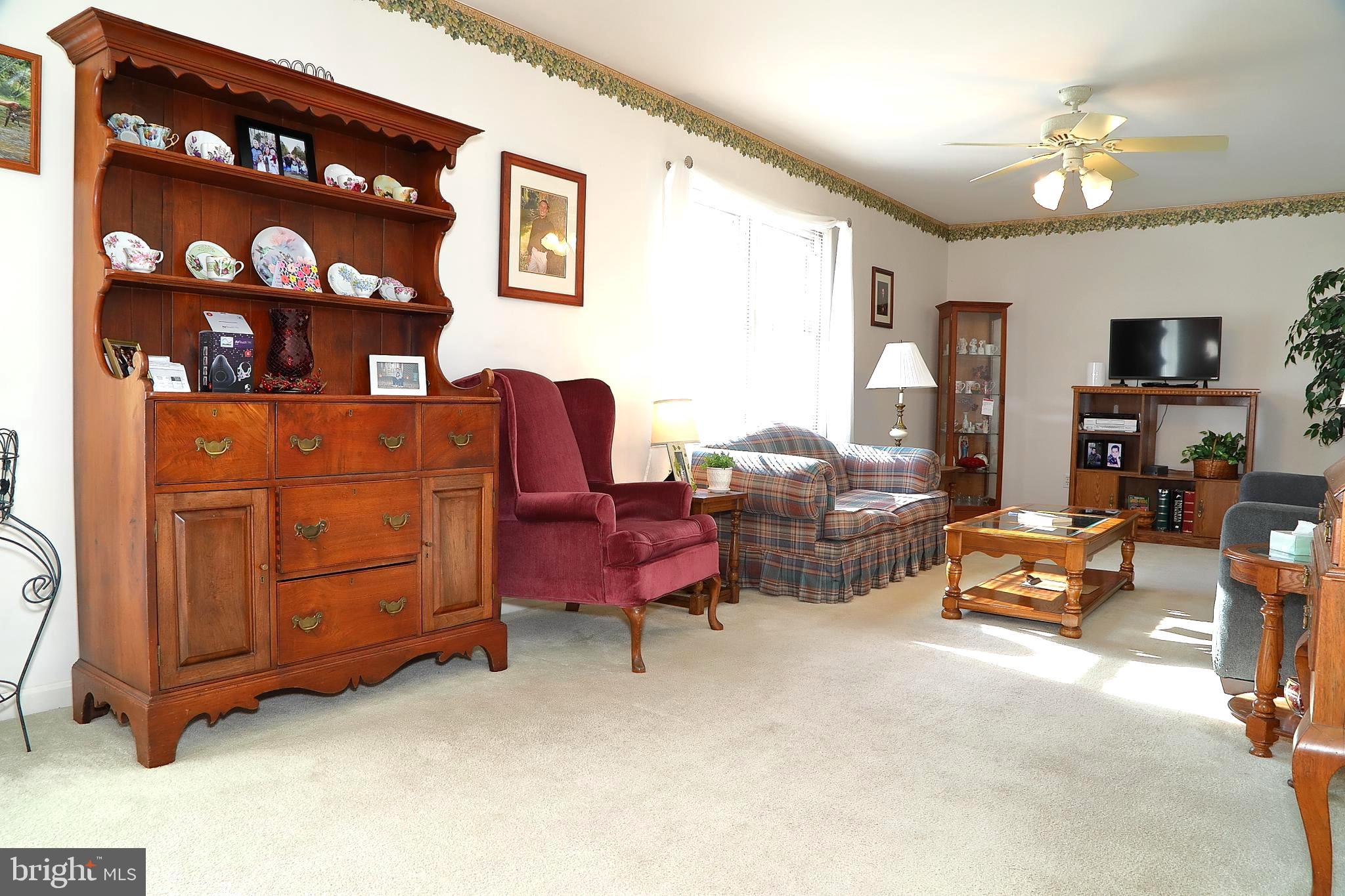 11 Duffield Drive Lititz, PA 17543 - Photo 6 of 22 a living room with furniture a couch and a bookshelf