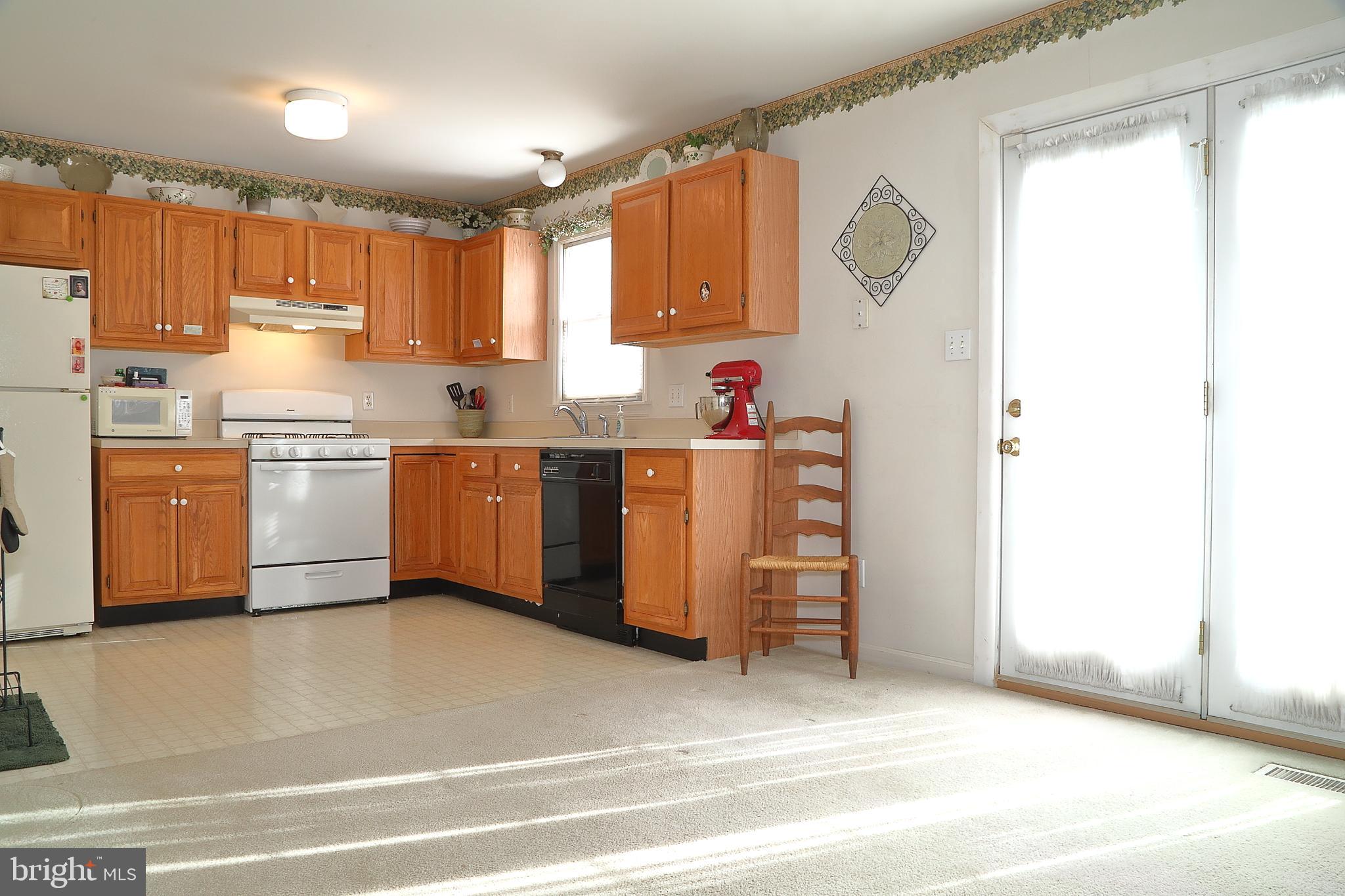 11 Duffield Drive Lititz, PA 17543 - Photo 10 of 22 a kitchen with stainless steel appliances granite countertop a stove and a refrigerator
