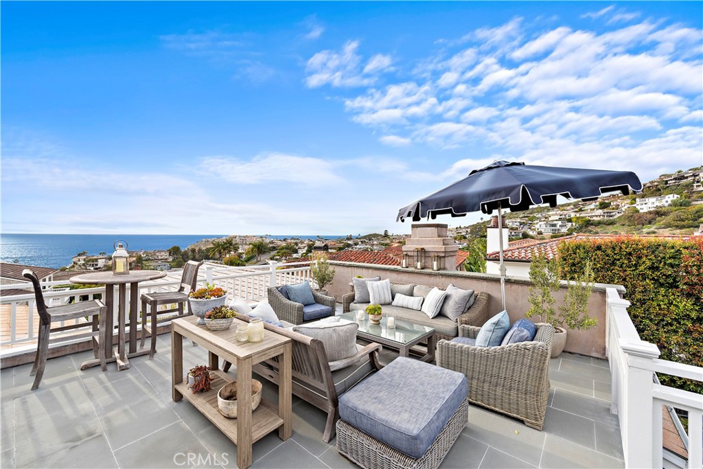 324 Emerald Bay Laguna Beach, CA 92651 - Photo 16 of 47 a terrace with outdoor seating and city view