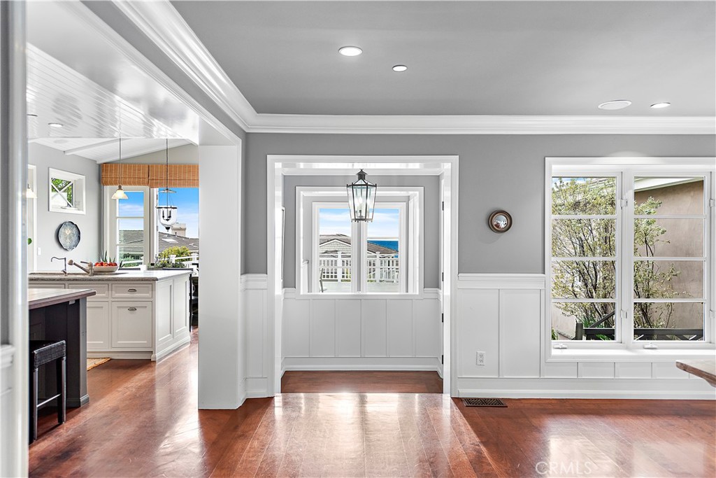 324 Emerald Bay Laguna Beach, CA 92651 - Photo 21 of 47 a view of a big room with wooden floor and windows