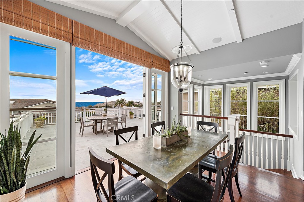 324 Emerald Bay Laguna Beach, CA 92651 - Photo 30 of 47 a view of a dining room with furniture window and wooden floor