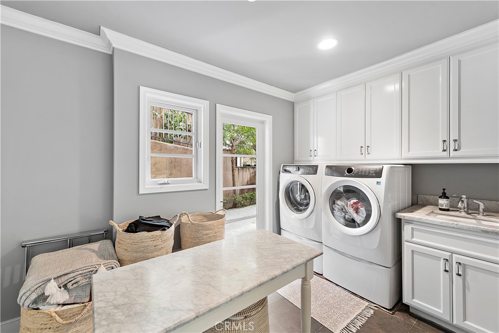 324 Emerald Bay Laguna Beach, CA 92651 - Photo 36 of 47 a utility room with sink dryer and washer
