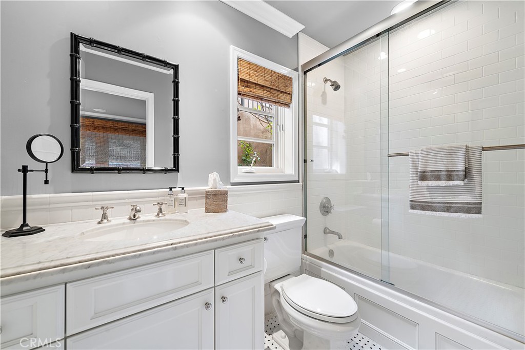 324 Emerald Bay Laguna Beach, CA 92651 - Photo 38 of 47 a bathroom with a toilet a sink a mirror a bathtub and shower