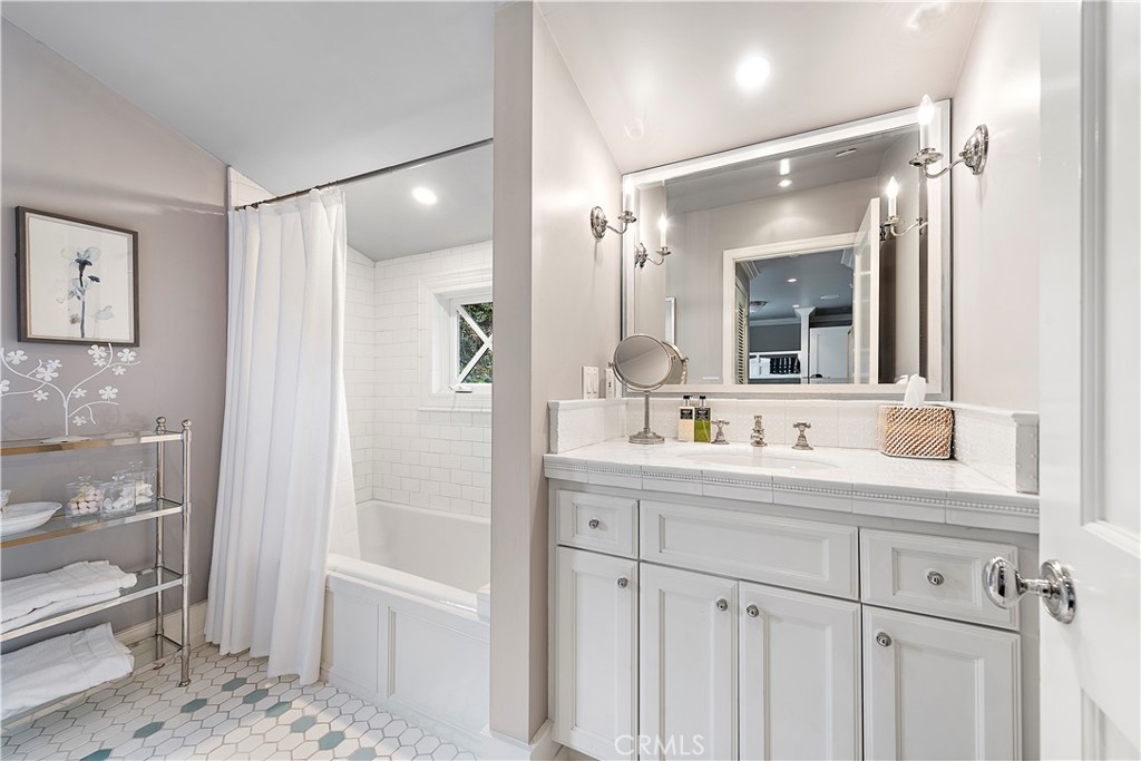 324 Emerald Bay Laguna Beach, CA 92651 - Photo 40 of 47 a bathroom with a shower sink and mirror