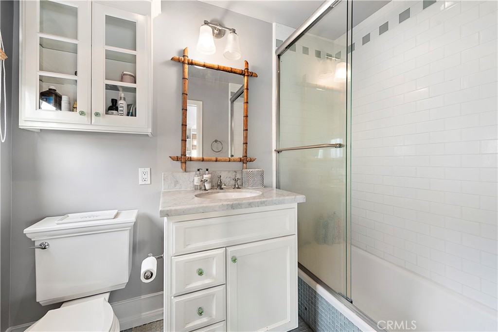 324 Emerald Bay Laguna Beach, CA 92651 - Photo 42 of 47 a bathroom with a granite countertop sink toilet and shower