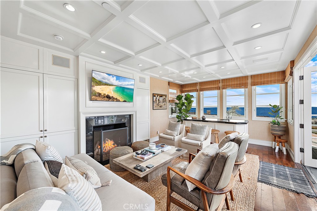 324 Emerald Bay Laguna Beach, CA 92651 - Photo 7 of 47 a living room with furniture fireplace and a large window