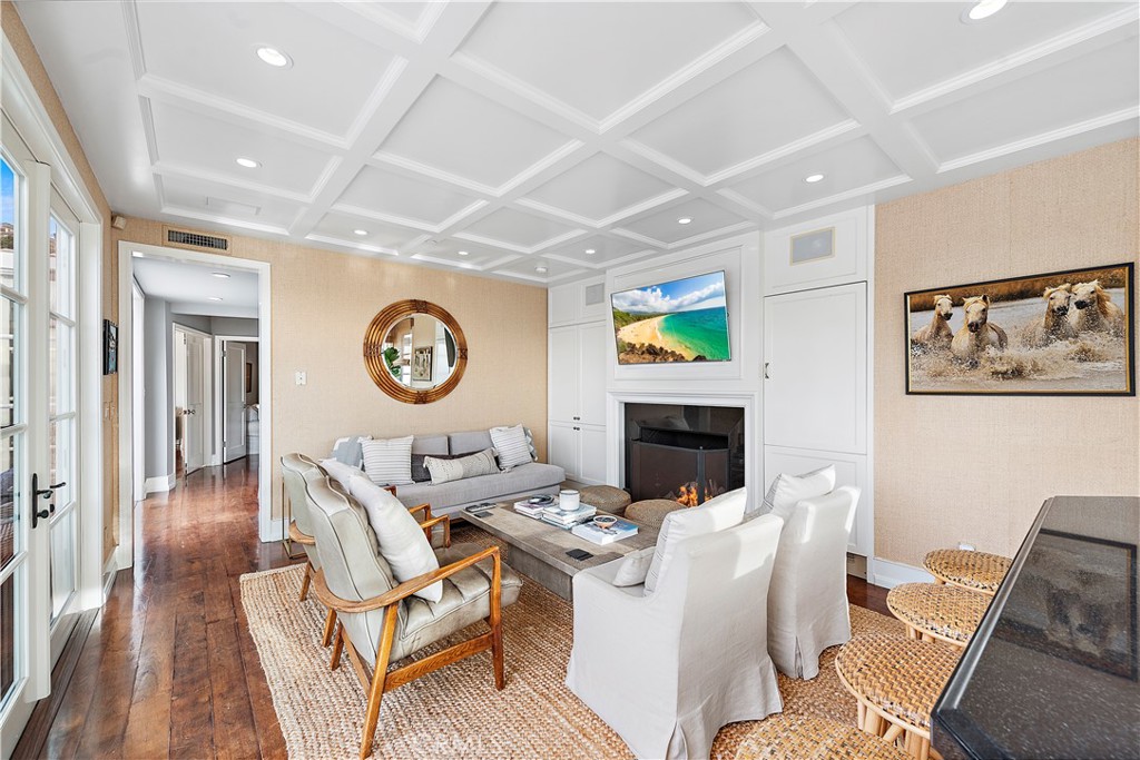 324 Emerald Bay Laguna Beach, CA 92651 - Photo 9 of 47 a living room with furniture a clock and a fireplace