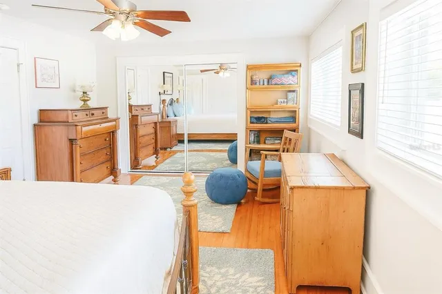 a living room with stainless steel appliances kitchen island granite countertop furniture and a flat screen tv