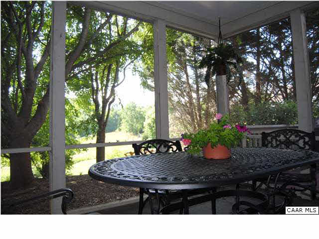 1030 Amber Ridge Road Charlottesville, VA 22901 - Photo 13 of 22 a view of a table and chairs in patio