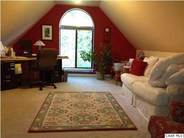 1030 Amber Ridge Road Charlottesville, VA 22901 - Photo 16 of 22 a living room with furniture rug and window