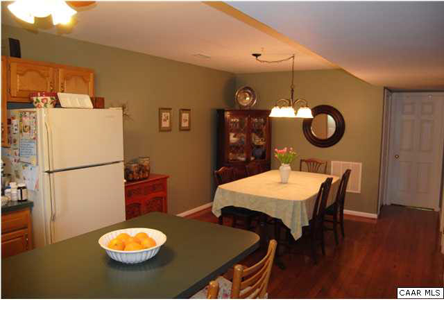 1030 Amber Ridge Road Charlottesville, VA 22901 - Photo 5 of 22 a view of a dining room with furniture and wooden floor