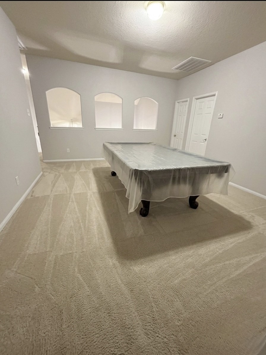 9908 Climbing Tree Street Conroe, TX 77385 - Photo 18 of 26 an empty room with windows