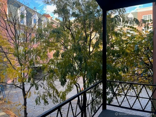 a view of a yard from a balcony