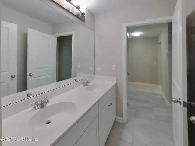 a bathroom with a toilet and a bathtub