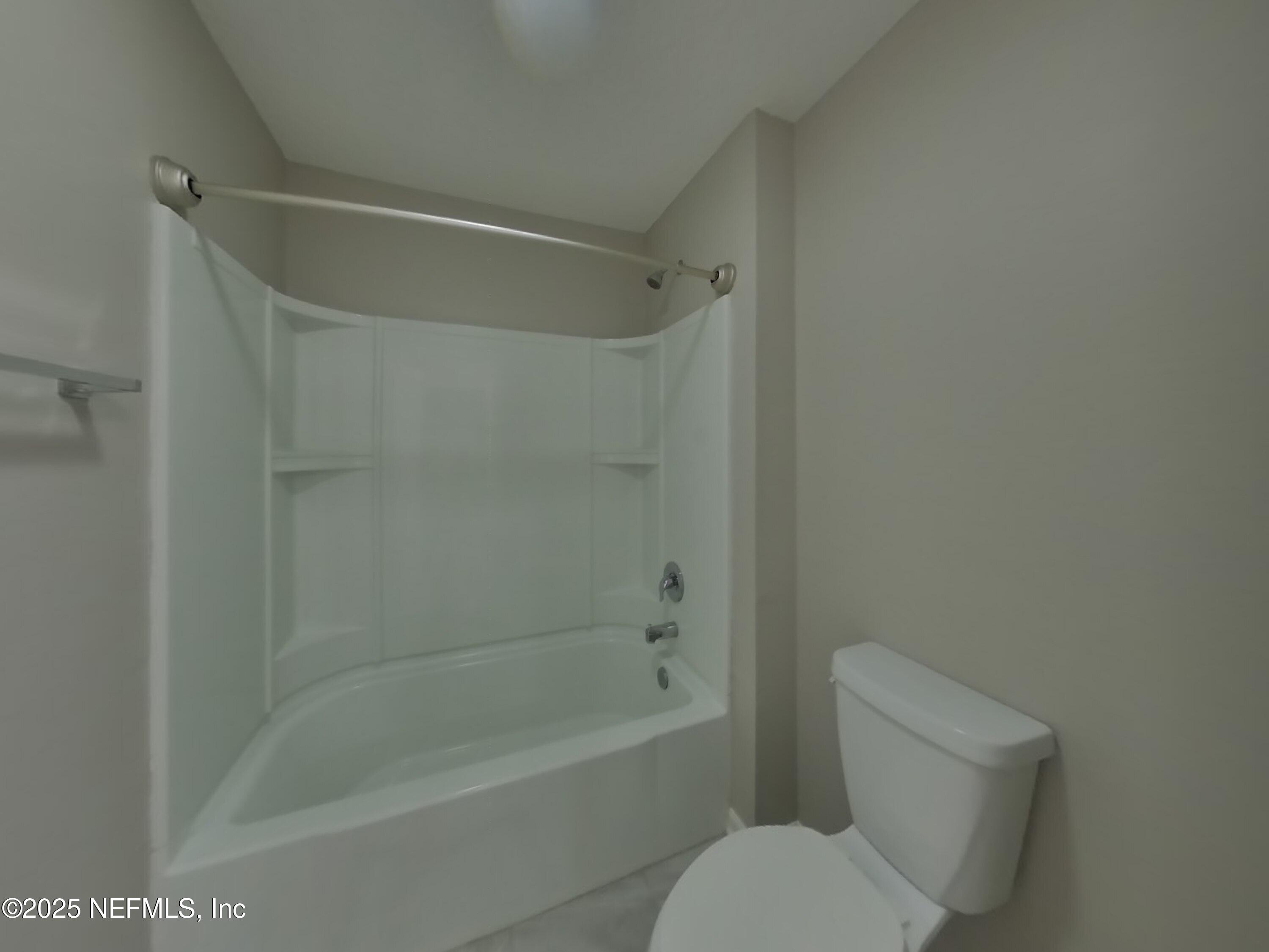 4889 Morning Rise Circle Jacksonville, FL 32218 - Photo 12 of 15 a bathroom with a toilet and a bathtub