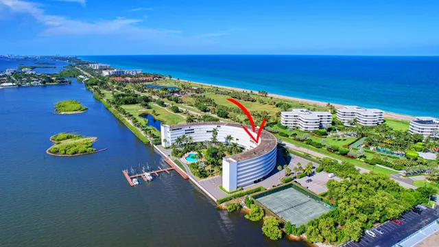 a view of water with boats and trees in the background