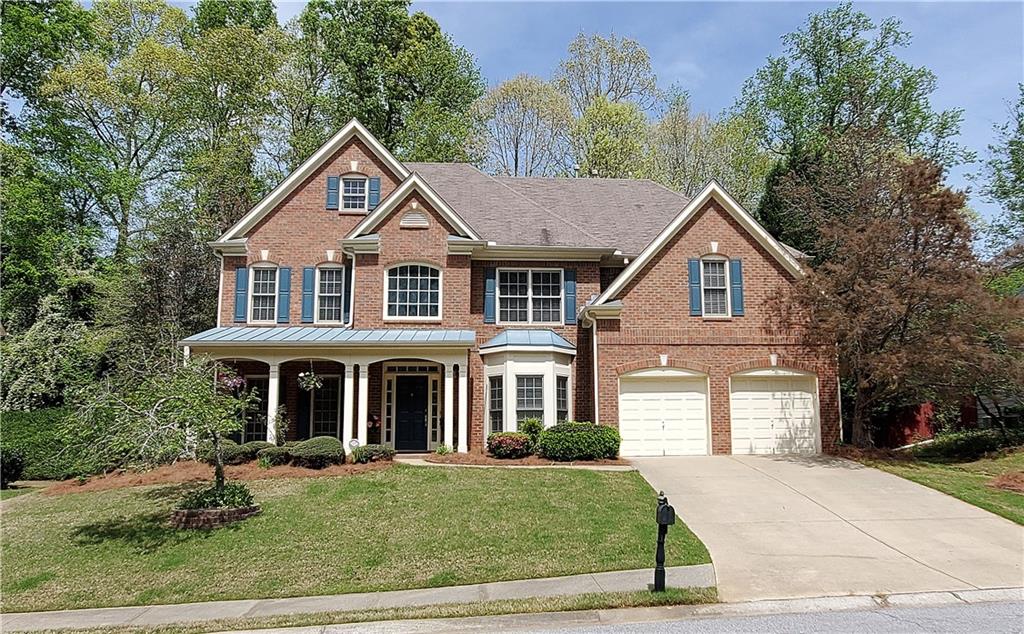 4115 Riverglen Circle Suwanee, GA 30024 - Photo 1 of 1 a front view of a house with a yard