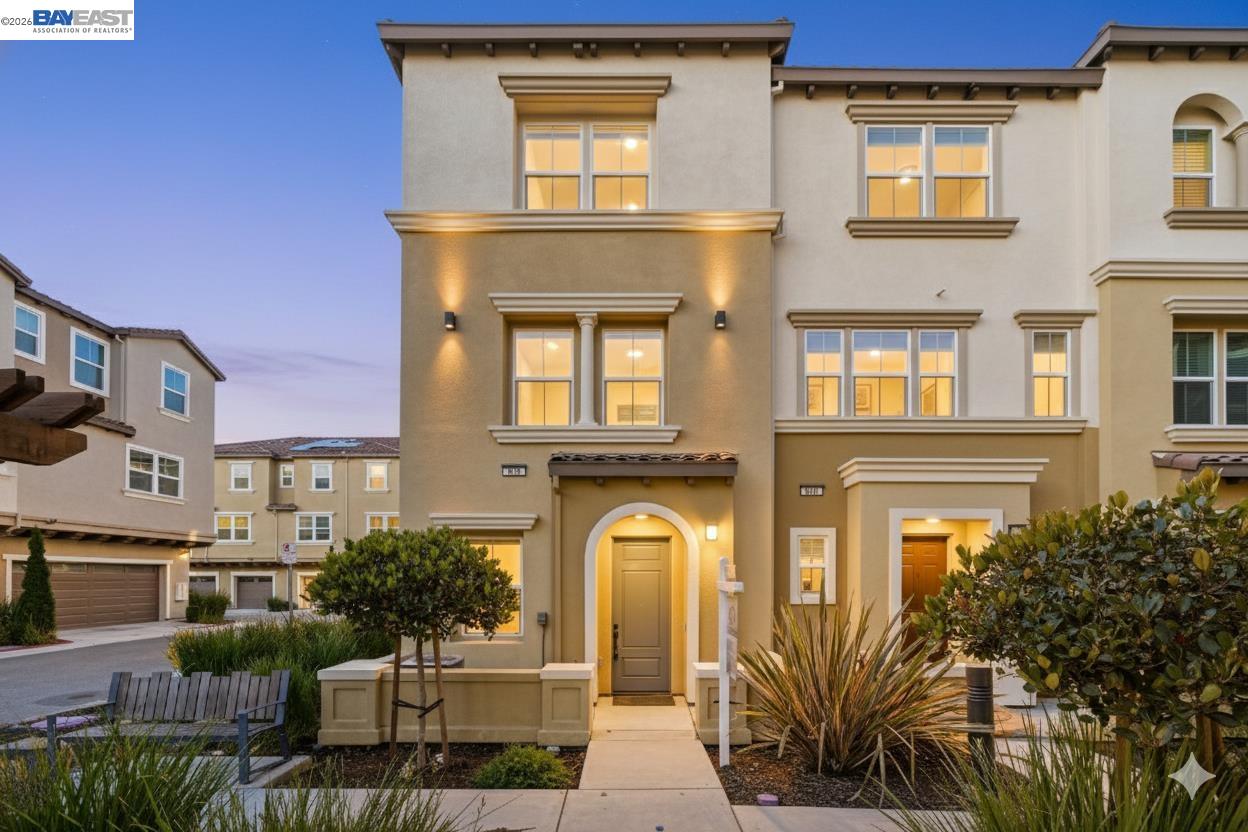 a view of a brick building with large windows