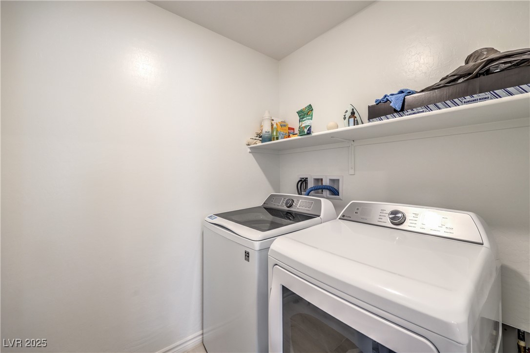 7232 North Decatur Boulevard, Unit 4 North Las Vegas, NV 89084 - Photo 27 of 36 Washroom featuring laundry area and independent washer and dryer