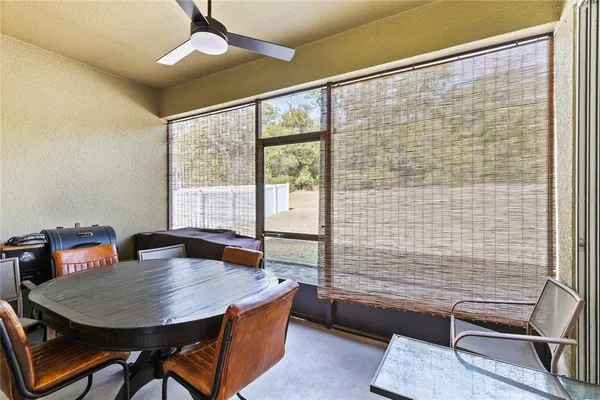 a dining room with furniture and window
