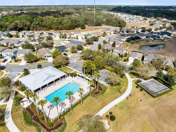an aerial view of a house with a swimming pool