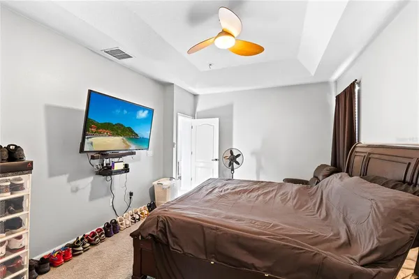 a bedroom with a bed and a cabinets