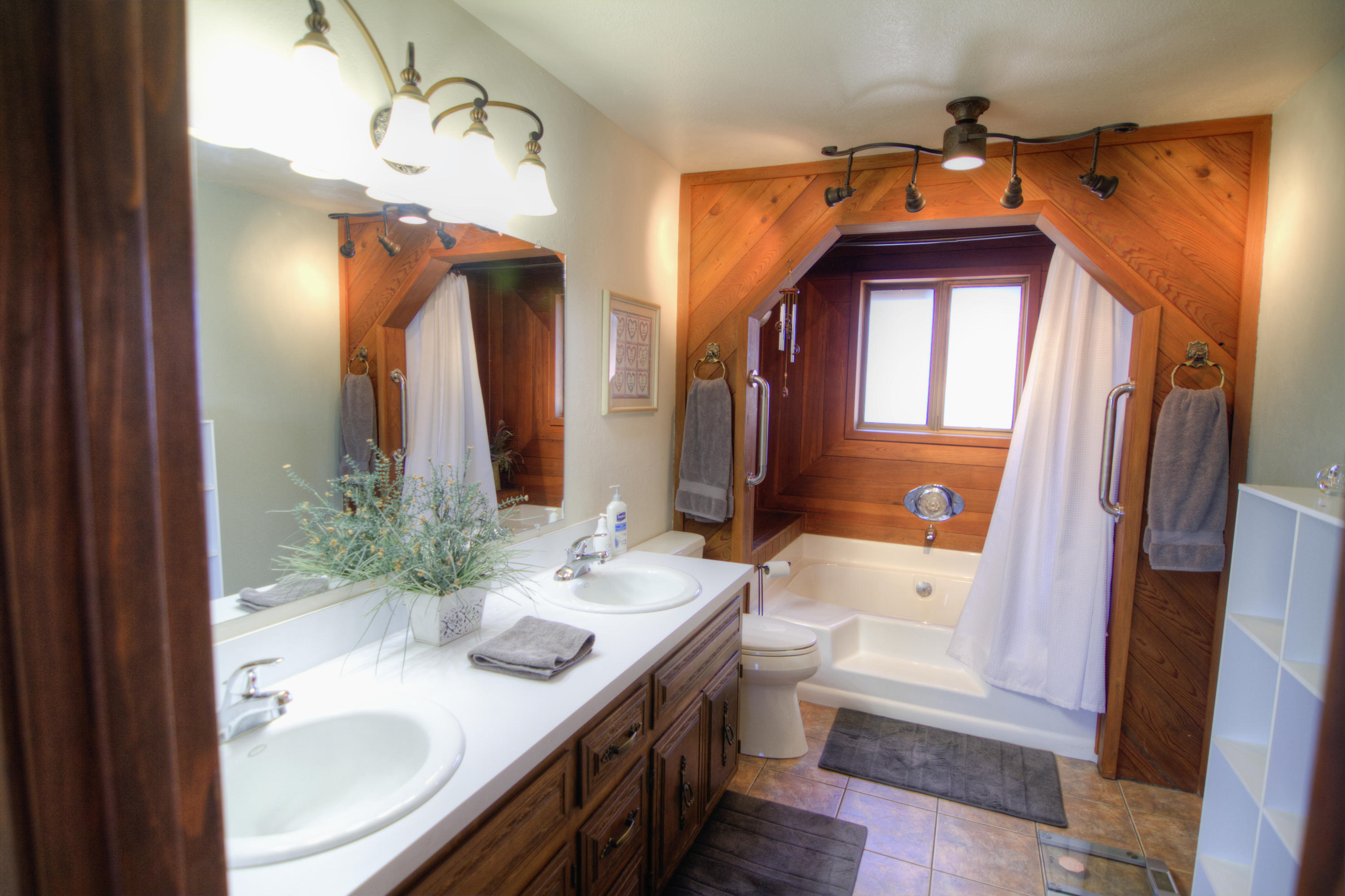 6518 Reeder Road Klamath Falls, OR 97603 - Photo 14 of 25 a bathroom with a granite countertop sink and a mirror