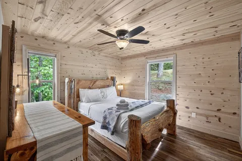 a bedroom with a bed and a view of balcony