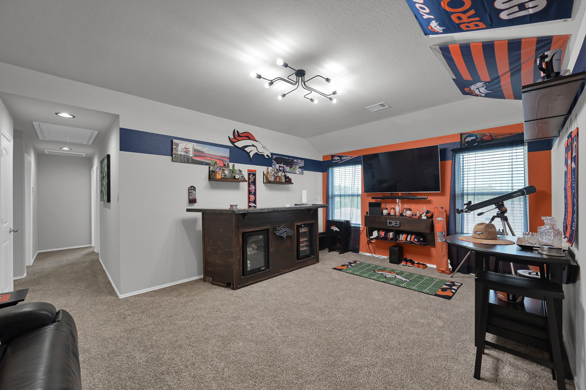 6302 Hendricks Harbor Conroe, TX 77304 - Photo 16 of 24 a view of a workspace with furniture and a flat screen tv