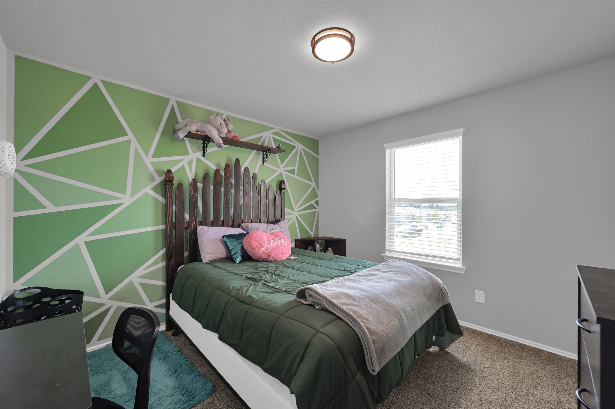 6302 Hendricks Harbor Conroe, TX 77304 - Photo 18 of 24 a bedroom with a bed and a window