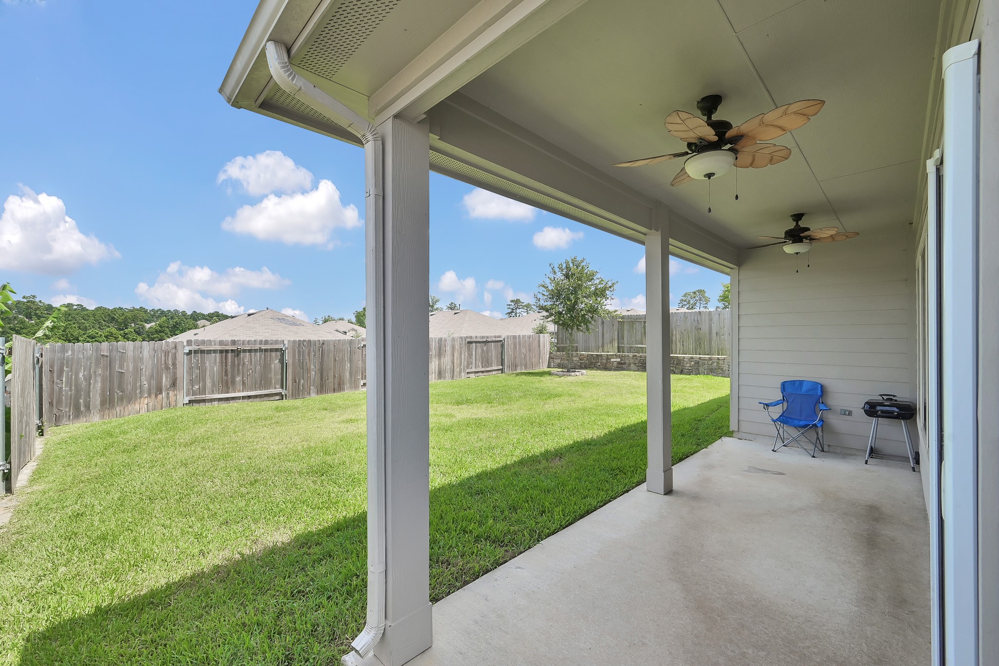 6302 Hendricks Harbor Conroe, TX 77304 - Photo 21 of 24 a view of a porch with a backyard
