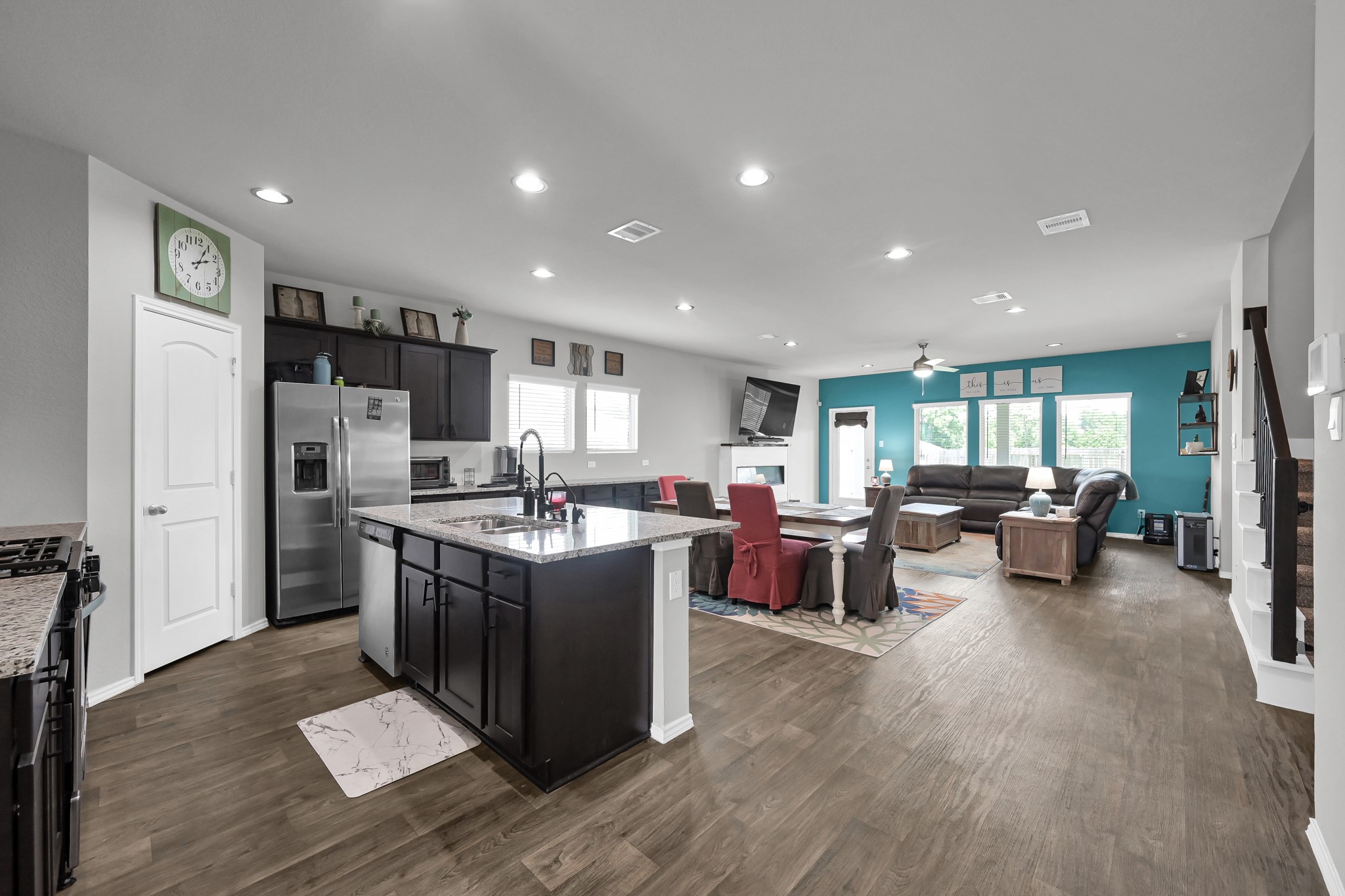 6302 Hendricks Harbor Conroe, TX 77304 - Photo 8 of 24 a kitchen with lots of counter top space and living room