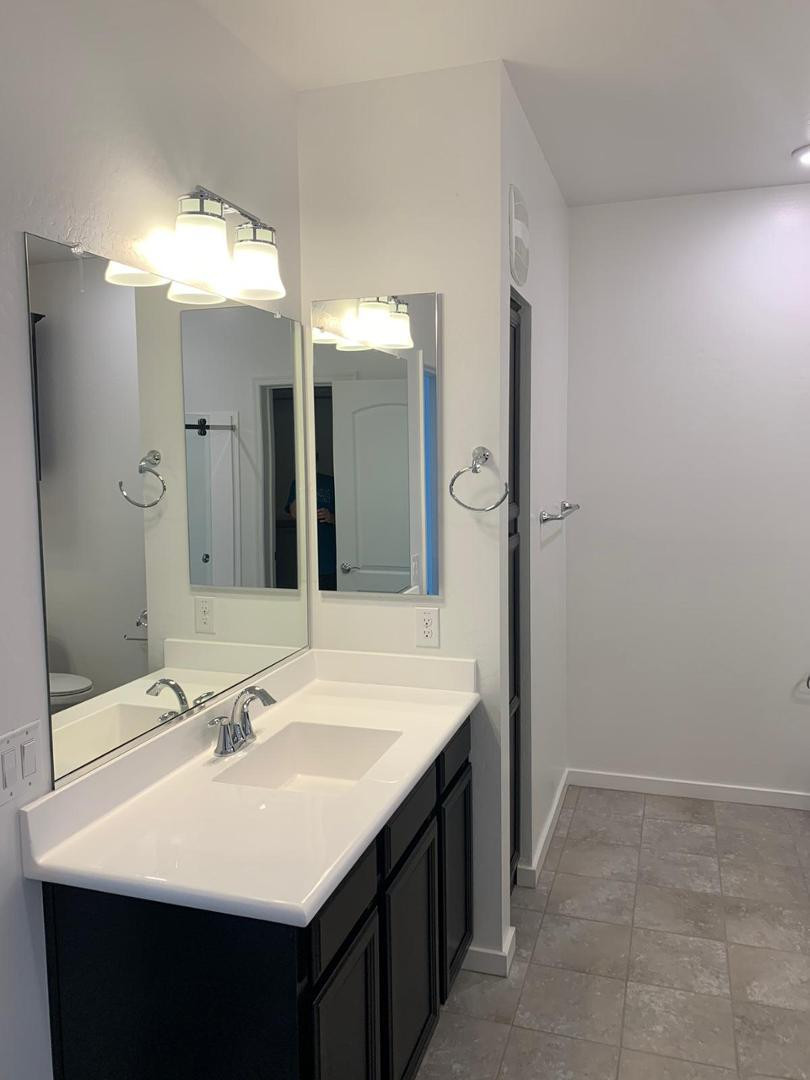 3900 East Baseline Road, Unit 118 Phoenix, AZ 85042 - Photo 25 of 32 a bathroom with a sink and a mirror