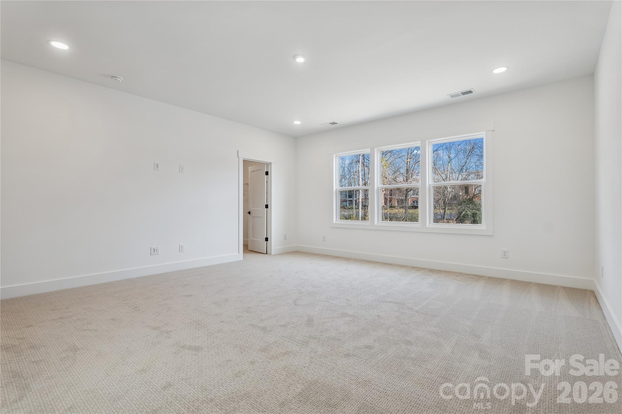 3024 Griffs Pond Road, Unit 388 Charlotte, NC 28269 - Photo 12 of 21 an empty room with windows
