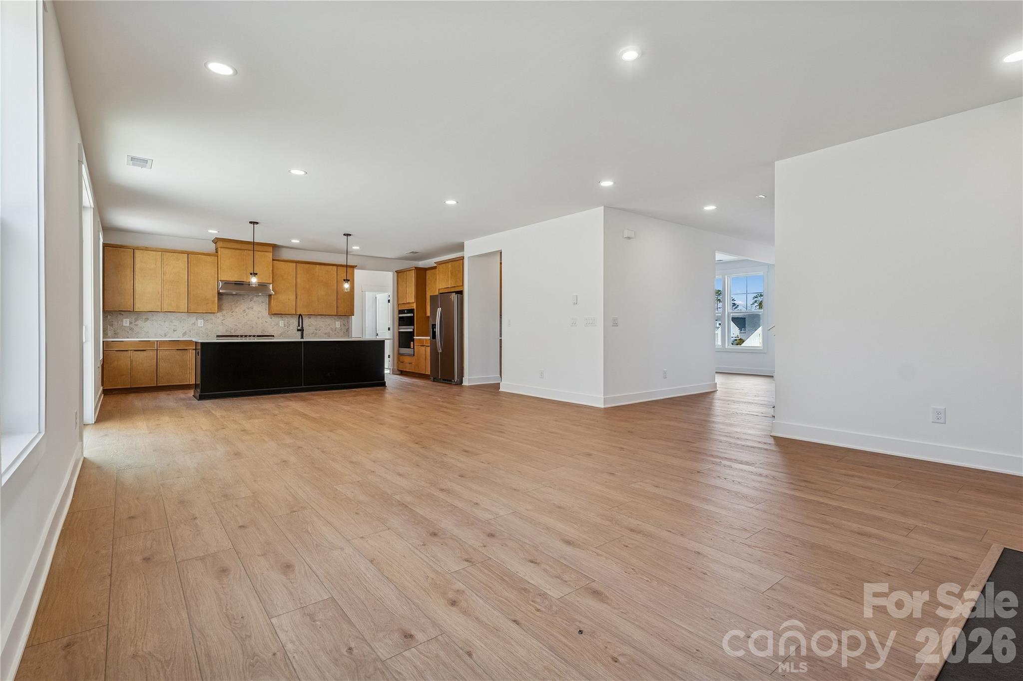 3024 Griffs Pond Road, Unit 388 Charlotte, NC 28269 - Photo 5 of 21 a view of empty room with wooden floor