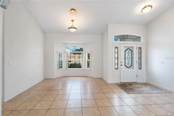 a view of a livingroom with wooden floor and a window