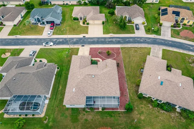 an aerial view of a house with a garden