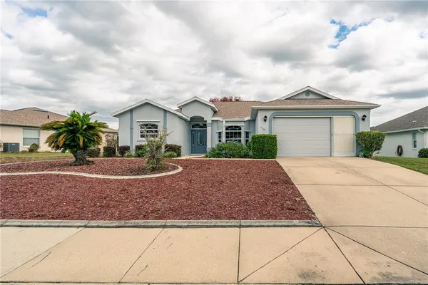 a view of a swimming pool with a yard