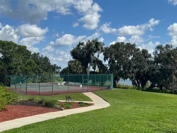 a view of a hallway view with wooden floor and staircase
