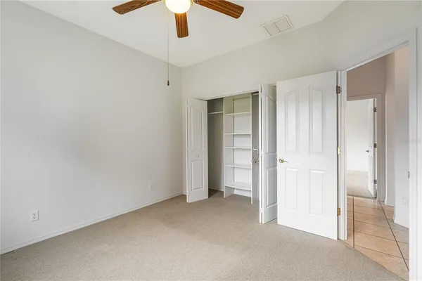 an empty room with closet area