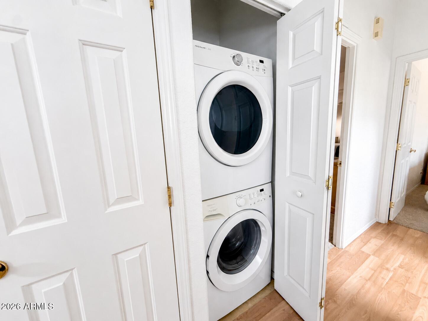 8865 East Baseline Road, Unit 103 Mesa, AZ 85209 - Photo 28 of 47 a view of a hallway with washer and dryer