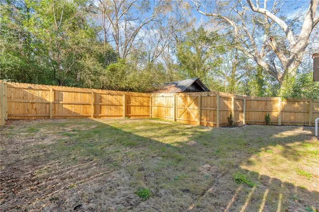 a view of house with outdoor space and swimming pool
