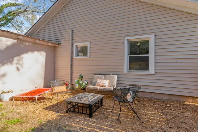 a view of a yard with an outdoor seating