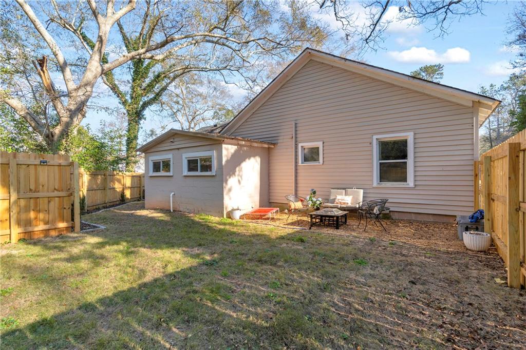 4106 Highway 29 Colbert, GA 30628 - Photo 30 of 82 a backyard of a house with fire pit and chairs