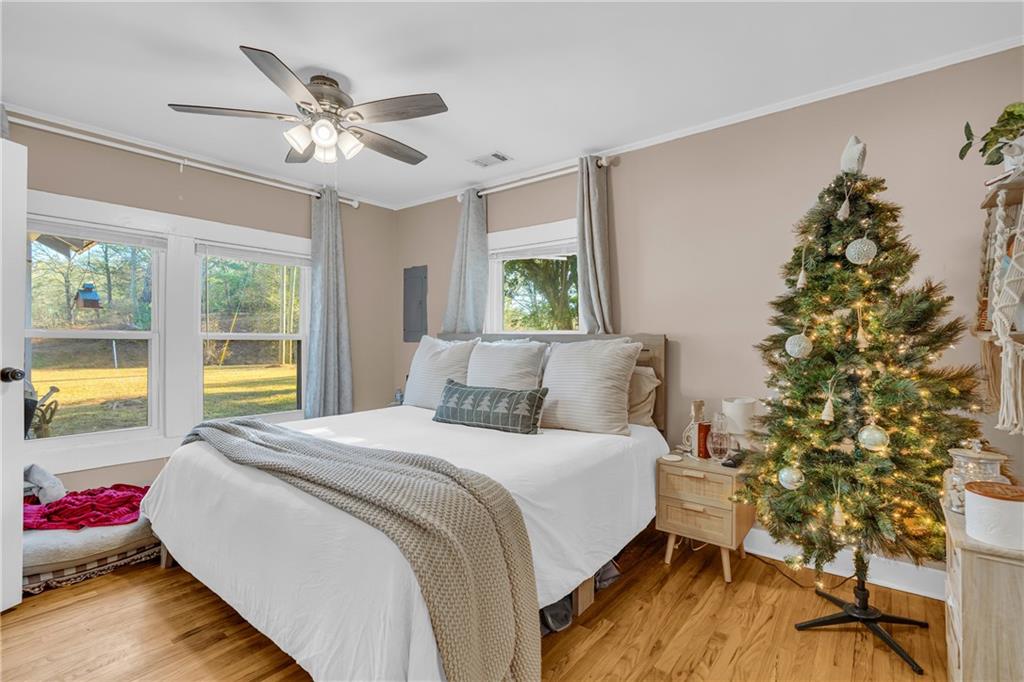 4106 Highway 29 Colbert, GA 30628 - Photo 58 of 82 a bedroom with a bed and a chandelier