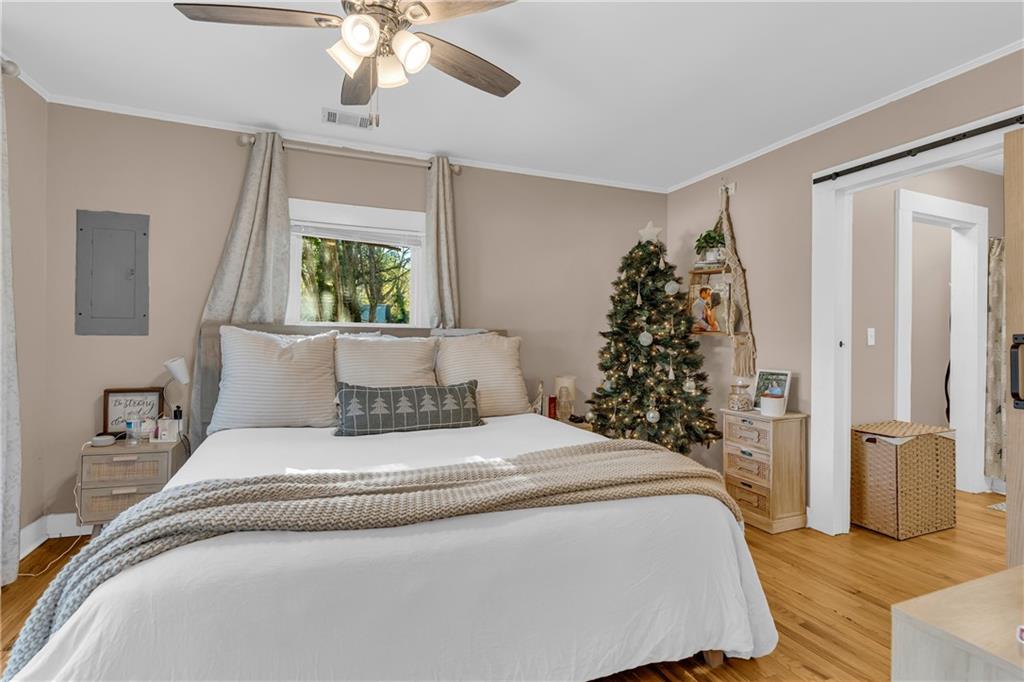 4106 Highway 29 Colbert, GA 30628 - Photo 70 of 82 a large bed sitting in a bedroom next to a window and a chandelier