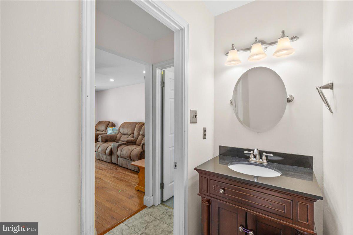 1795 Witherspoon Court Sewell, NJ 08080 - Photo 15 of 32 a en suite bathroom with a granite countertop sink and a mirror