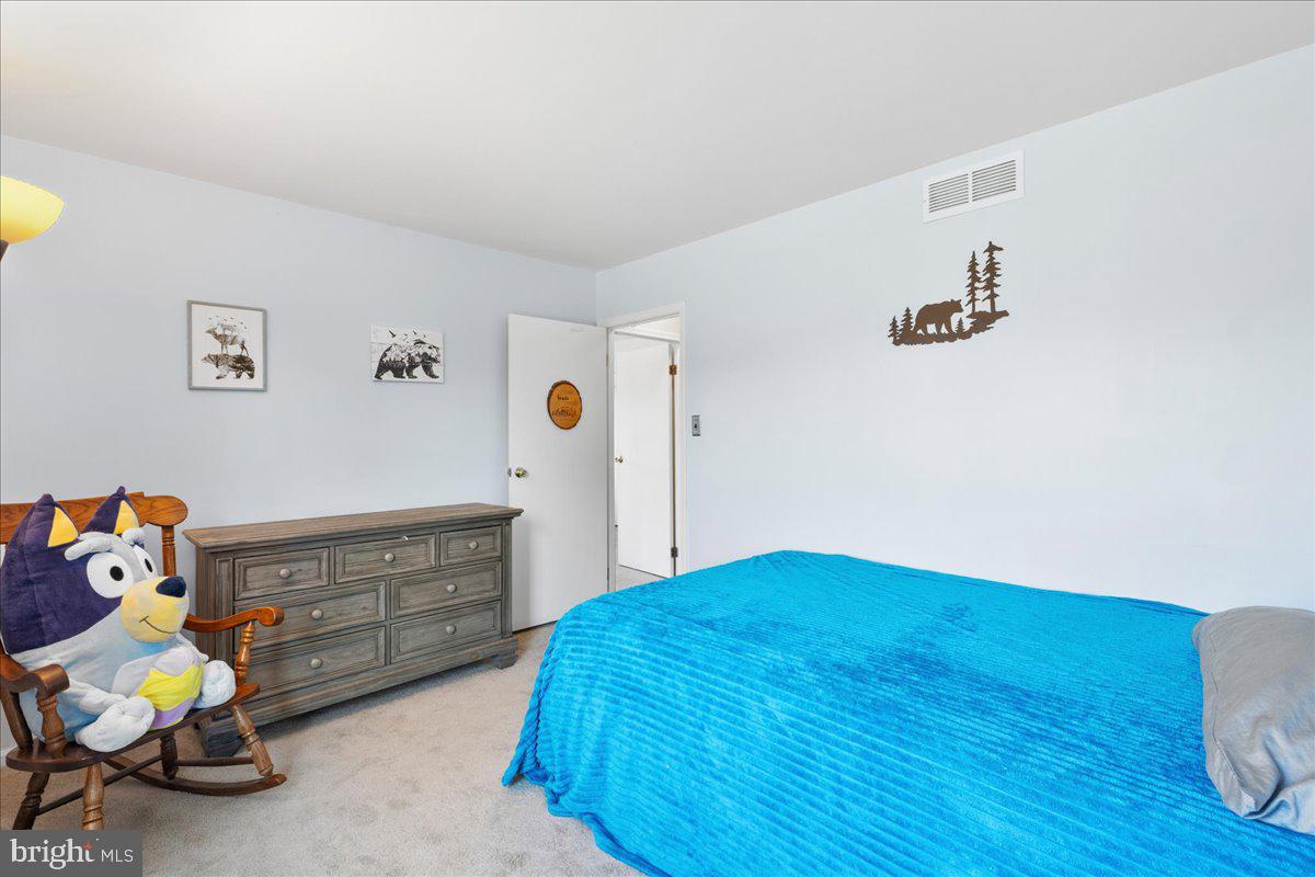 1795 Witherspoon Court Sewell, NJ 08080 - Photo 19 of 32 a bedroom with a bed and wooden floor